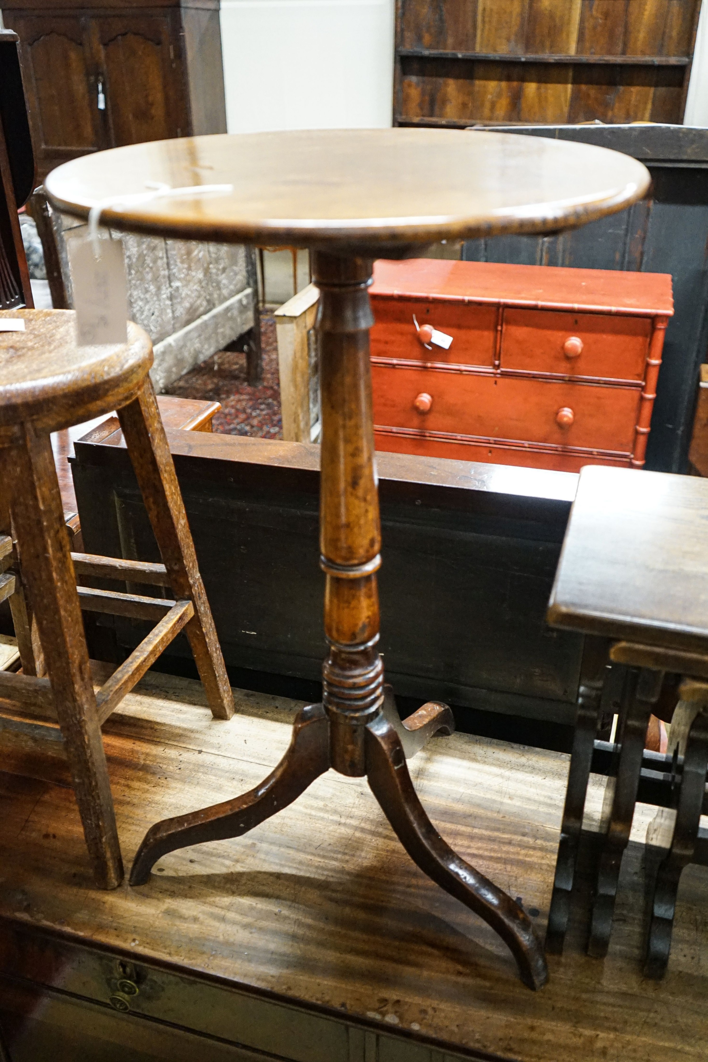 A 19th century circular mahogany tripod wine table, diameter 45cm, height 74cm, together with a nest of tea tables, and a provincial tall oak stool